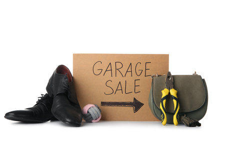 Unwanted stuff and cardboard with text GARAGE SALE isolated on white backgroundの写真素材