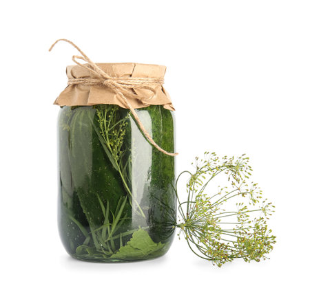 Jar with canned cucumbers and dill on white backgroundの写真素材
