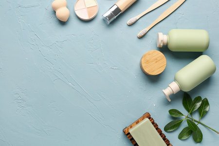 Composition with cosmetic products, toothbrushes and makeup sponge on color backgroundの写真素材