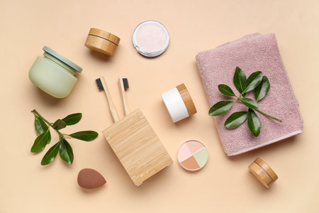 Composition with different bath supplies and plant branches on color backgroundの写真素材