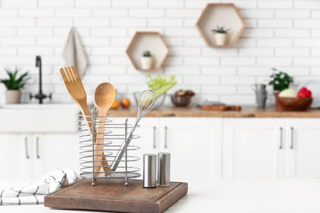 Cooking utensils on table in kitchenの写真素材