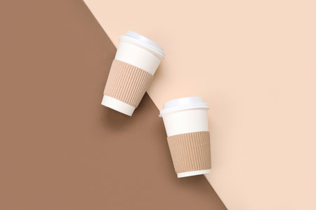 Takeaway paper cups on color backgroundの写真素材