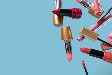 Different lipsticks flying against color backgroundの写真素材