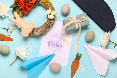 Composition with greeting card, stewardess hat, paper planes and Easter decor on color background