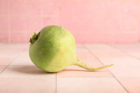 Ripe watermelon radish on white tile tableの写真素材