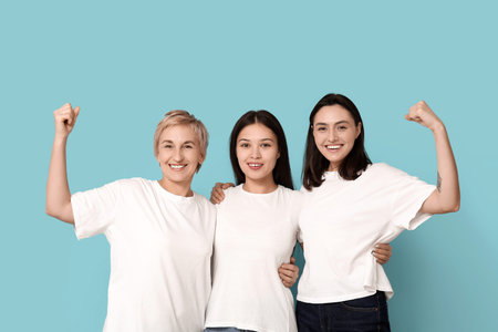Portrait of beautiful women on blue background. Women history month