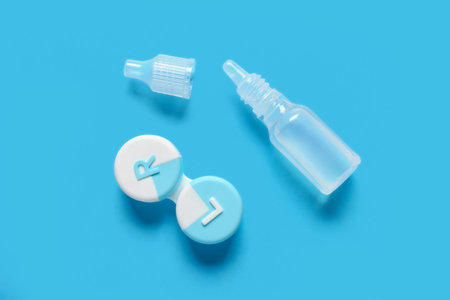 Container for contact lenses with solution on blue background