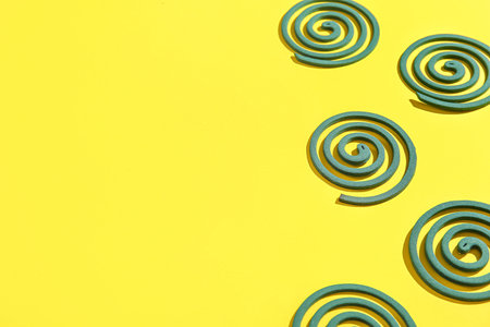Mosquito spirals on yellow background
