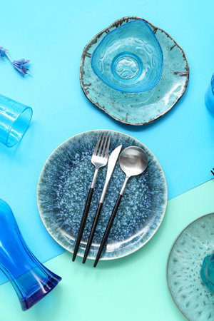 Beautiful table setting on color background