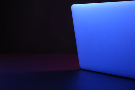 Modern laptop on black background