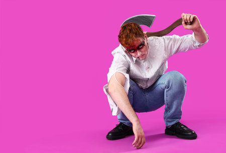 Scary zombie man with ax on purple background