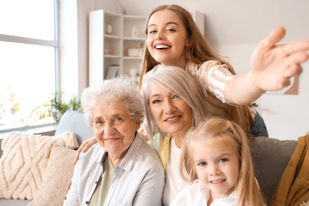Little girl with her family sitting on sofa at home