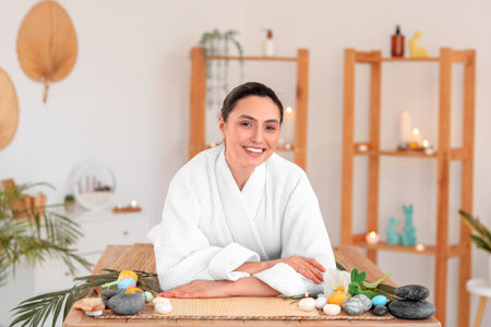 Young woman relaxing in spa salon on Easter Day