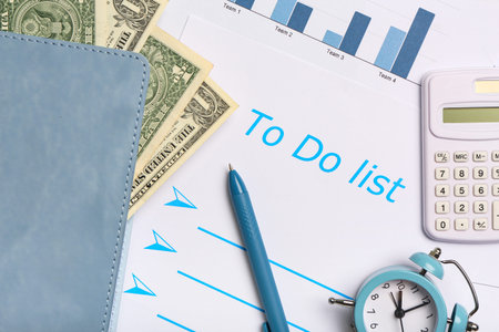 Composition with to do list, money, calculator and diagram. Time management concept. Closeup