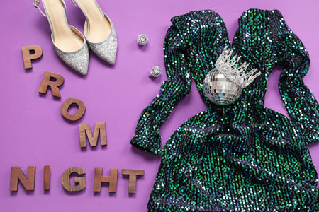 Text PROM NIGHT with dress, shoes and disco ball on purple backgroundの写真素材