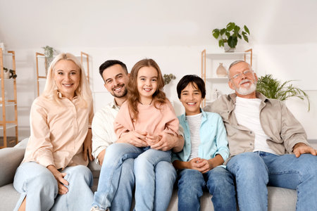 Big family sitting on sofa at home
