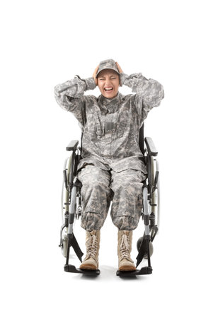 Female soldier in wheelchair with PTSD on white backgroundの写真素材