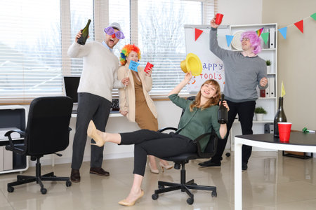 Business people celebrating April Fools' Day at office partyの写真素材