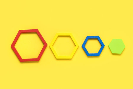 Children toys on yellow background. concept of autistic disorder