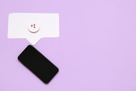 Mobile phone with blank screen and speech bubble with +1 icon on lilac background. New message