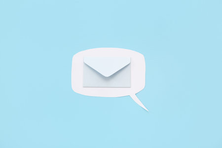 Speech bubble with envelope on blue background. New message