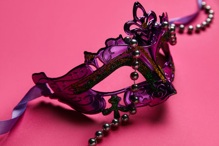 Carnival mask on pink backgroundの写真素材