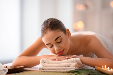 Pretty young woman in spa salonの写真素材