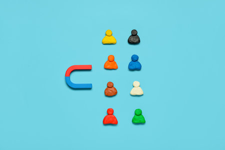 Magnet with group of customers on blue background. Marketing conceptの写真素材