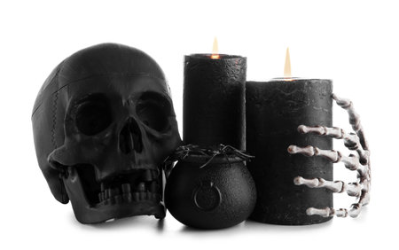 Wax candles and decor for Halloween on white backgroundの写真素材