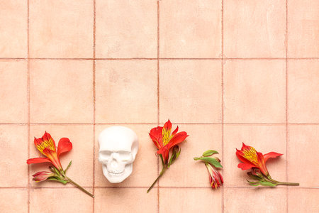 Human skull with beautiful lily flowers on pink tile background