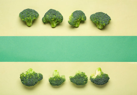 Fresh green broccoli on color backgroundの写真素材