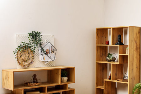 Shelf units with pegboard in light roomの写真素材
