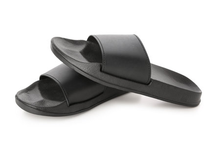 Black female flip flops on white backgroundの写真素材