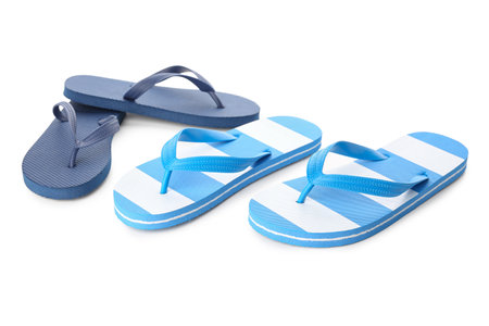 Colorful pairs of female flip flops on white backgroundの写真素材