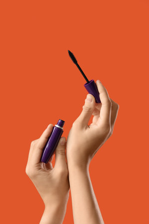 Woman with mask on red backgroundの写真素材