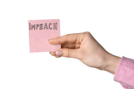 Woman holding piece of paper with word IMPEACH on white background