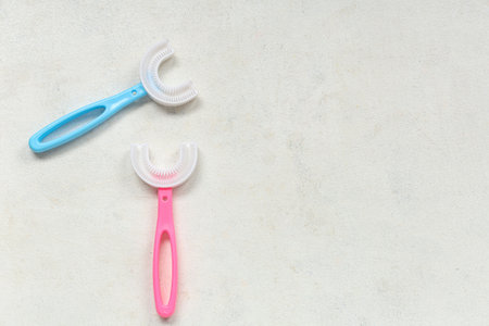 Children's toothbrushes on white grunge backgroundの写真素材