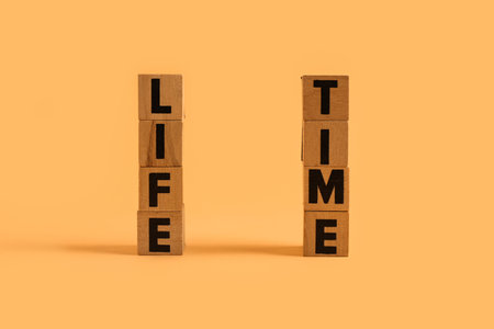 Cubes with text LIFE TIME on orange backgroundの写真素材