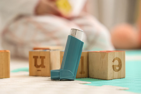 Asthma inhaler with cubes in pediatric clinic, closeupの写真素材