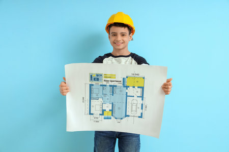 Little architect with house plan on blue background