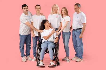 People with pink and blue awareness ribbons on color background. World Cancer Day