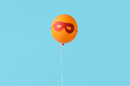 Floating balloon with sleeping mask on blue backgroundの写真素材