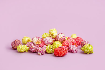 Sweet colorful popcorn on lilac backgroundの写真素材