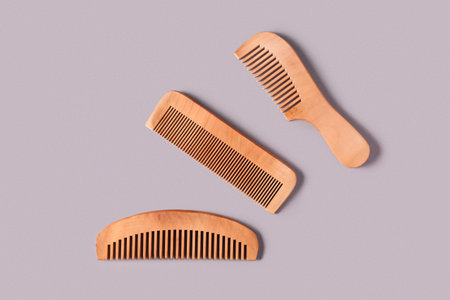 Hair wooden combs on gray background