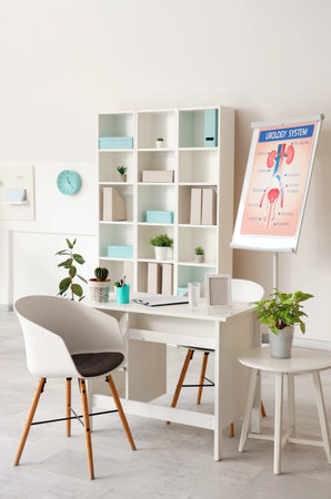 Interior of light medical office with workplace and shelf unit