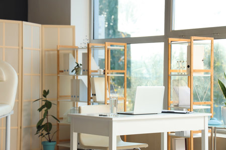 Interior of medical office with workplace and shelf unitsの写真素材