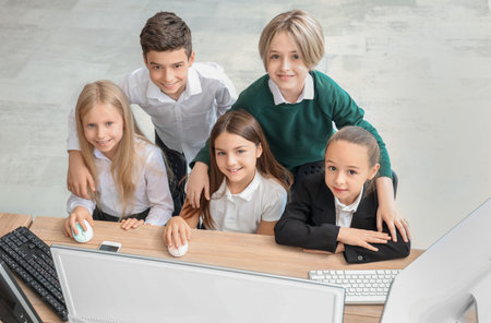 Little children studying at school computer lab