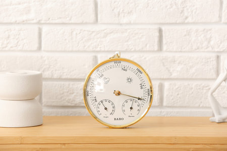 Aneroid barometer on table in room, closeup
