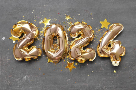 Composition with figure 2024 made of foil balloons on gray backgroundの写真素材