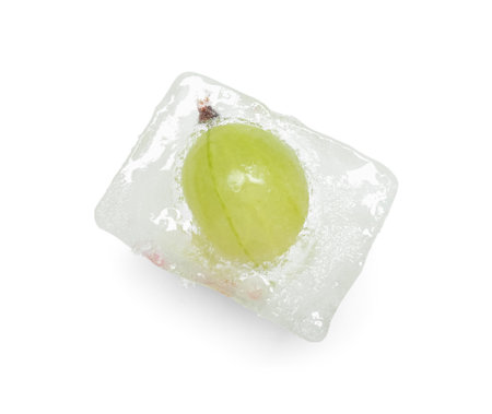 Frozen gooseberry in ice cube on white backgroundの写真素材